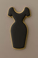 Black dress-shaped cookie with gold trim on a brown background from a 4 inch Dress Metal Cookie Cutter