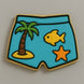 Cookie with blue shorts design featuring a palm tree, fish, and starfish on a gray background from a 3.5 inch Shorts Metal Cookie Cutter