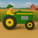 Tractor with a farmer figure on a farm background from a 4 inch Farmer on a Tractor Metal Cookie Cutter