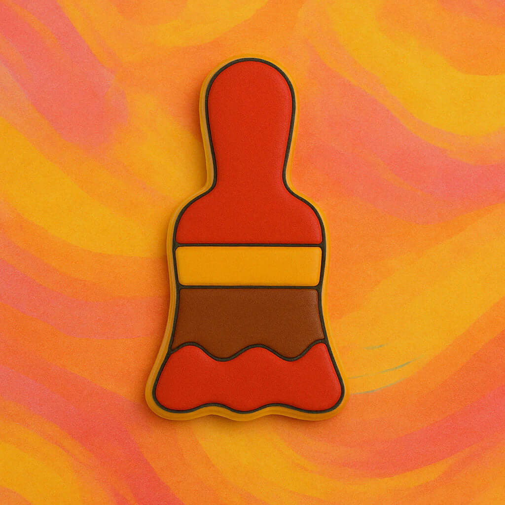 Paintbrush-shaped object on a swirling orange and pink background from a 4 inch Paint Brush Metal Cookie Cutter