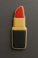 Cookie shaped like a lipstick on a gray background from a 3.5 inch Makeup Lipstick Metal Cookie Cutter