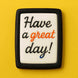 Cookie with 'Have a great day!' text on a yellow background from a 2.5 inch X 1.43 inch Rectangle Biscuit Metal Cookie Cutter