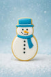 Decorative snowman cookie with blue hat and scarf on a snowy background for a 4 inch Snowman Metal Cookie Cutter