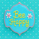 Decorative cookie with 'Bee Happy' text on a blue background with white polka dots from a 5 inch Plaque or Frame Metal Cookie Cutter