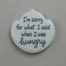Cookie with text 'I'm sorry for what I said when I was hungry' on a gray background from a 4.75 inch Plaque or Frame Metal Cookie Cutter