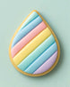 Teardrop-shaped cookie with pastel color stripes on a light green background from a 2.5 inch Tear Drop Rain Flower Petal Metal Cookie Cutter