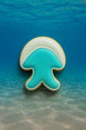 Jellyfish-shaped cookie on a blue underwater background from a 3.5 inch Jellyfish Metal Cookie Cutter