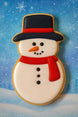 Snowman cookie with a blue snowy background from a 4.5 inch Snowman Metal Cookie Cutter