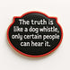 4.5 inch Plaque Metal Cookie Cutter with black background and white text: 'The truth is like a dog whistle, only certain people can hear it.'