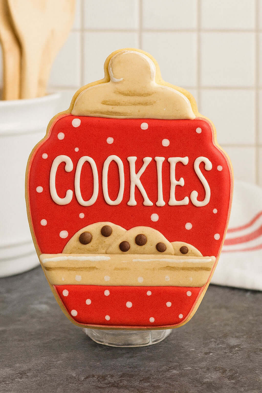 Cookie-shaped cookie jar with 'COOKIES' text on a kitchen counter from a 4 inch Cookie Jar Metal Cookie Cutter