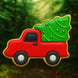 Red toy truck with a green Christmas tree on a forest background from a 2.5 inch Mini Truck with Tree Metal Cookie Cutter