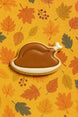 Cookie shaped like a roasted turkey on an autumn leaf pattern from a 2.25 inch Mini Turkey Dinner Metal Cookie Cutter