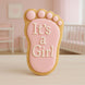 Cookie shaped like a baby footprint with 'It's a Girl' text in a nursery setting from a 2 inch Mini Right Foot Metal Cookie Cutter