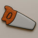 Decorative hand saw with wooden handle on a beige background from a 2 inch Mini Hand Saw Metal Cookie Cutter