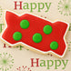 Red and green polka dot cookie with 'Happy' text on a decorative background from a 2 inch Mini Zig Zag Interlocking Brick Metal Cookie Cutter
