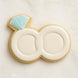 Cookie shaped like a wedding ring with a blue gemstone on a white background from a 1.75 inch Mini Double Wedding Rings Metal Cookie Cutter