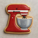 Cookie shaped like a red stand mixer with a gray bowl on a beige background from a 2.25 inch Mini Stand Mixer Metal Cookie Cutter