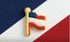 Cookie shaped like a letter 'H' with American flag design on a red, white, and blue striped background from a 2 inch Mini Flag Metal Cookie Cutter