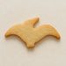 Biscuit shaped like a pterodactyl  on a beige background from a 4.75 inch Pterodactyl Metal Cookie Cutter