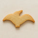 Biscuit shaped like a pterodactyl  on a beige background from a 4.75 inch Pterodactyl Metal Cookie Cutter