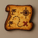 Pirate treasure map cookie with compass, palm trees, and X on a beige background from a 5 inch Santa Nice Naughty Scroll Metal Cookie Cutter