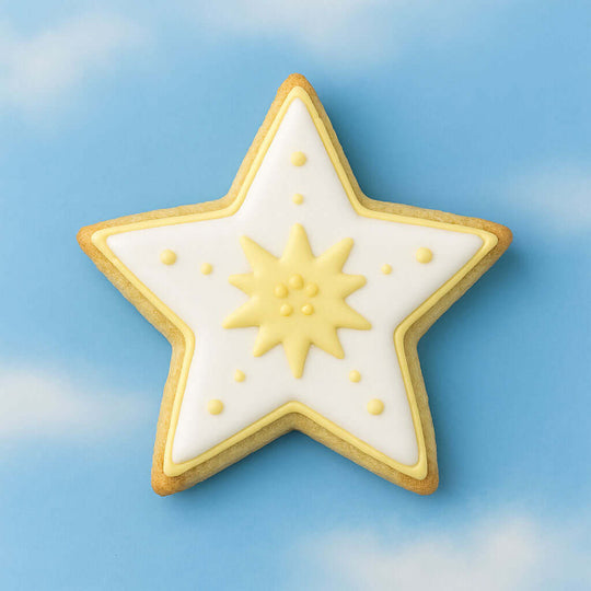 Decorative star-shaped cookie featuring yellow and white icing, inspired by the 2.5 inch Star Metal Cookie Cutter.