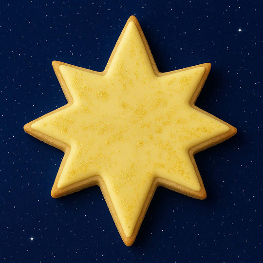 3.5 inch Star of Bethlehem Moravian Star Metal Cookie Cutter shaped yellow cookie on a dark starry background.