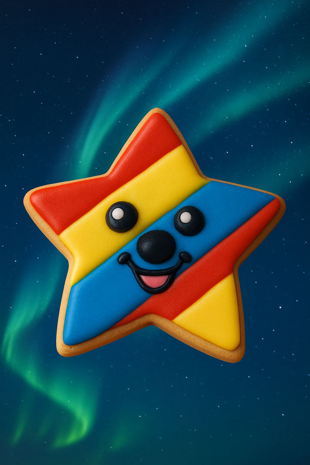 2 inch Mini Star Metal Cookie Cutter shaped cookie decorated with colored icing and a smiley face.