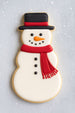 Decorative snowman cookie with a black hat, red scarf, and white face on a light gray background from a 5 inch Snowman Metal Cookie Cutter