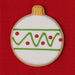 Decorative cookie shaped like a Christmas ornament with green and red icing on a red background from a 3 inch Ornament or Fishing Bobber Metal Cookie Cutter