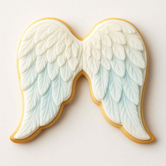 Decorative cookie shaped like angel wings on a white background from a 4.25 inch Angel or Cupid Wings Metal Cookie Cutter