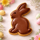 Chocolate bunny cookie on a marble surface with Easter eggs and flowers from a 3.25 inch Chocolate Easter Bunny Rabbit Metal Cookie Cutter