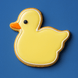 2.5 inch Duckling Metal Cookie Cutter shaped yellow duck cookie on blue background.