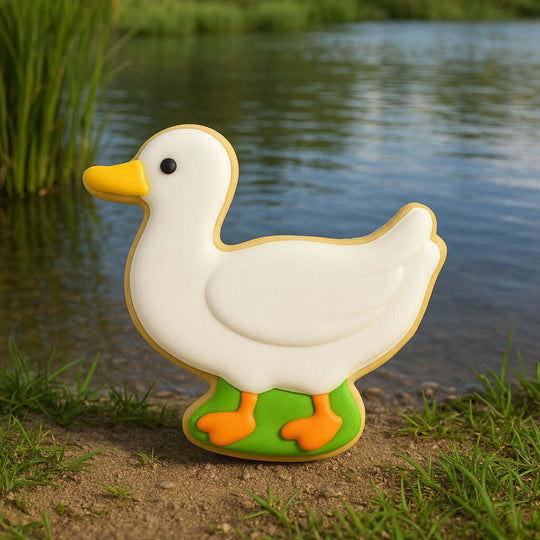 Decorative duck-shaped cookie by a body of water from a 3 inch Duck Metal Cookie Cutter