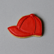 Red cap-shaped cookie on a gray background