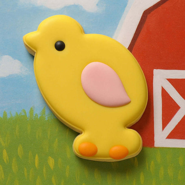 Yellow chick cookie on a colorful farm-themed background from a 4 inch Chick Metal Cookie Cutter