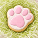 3.5 inch Bunny Rabbit Foot Metal Cookie Cutter decorated cookie with pink icing on green grass.