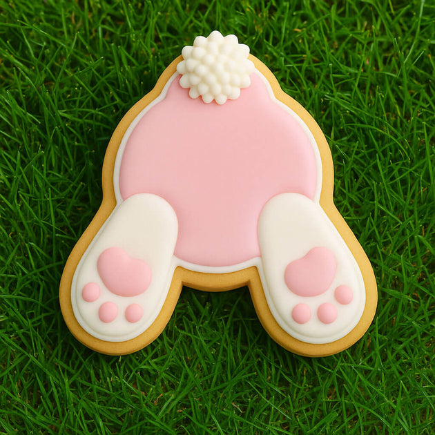 Decorative cookie shaped like a rabbit 's butt on grass from a 4 inch Easter Bunny Rabbit Butt Metal Cookie Cutter
