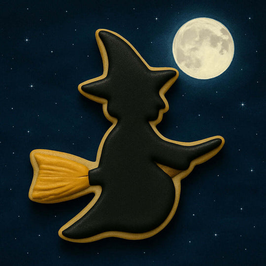 Halloween-themed cookie shaped like a witch on a broomstick against a night sky with a full moon.