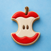 Cookie shaped like a stylized apple with a blue background from a 4 inch Apple Core Metal Cookie Cutter