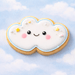 Cloud-shaped cookie with a smiling face on a blue sky background from a 3.5 inch Double Heart Metal Cookie Cutter