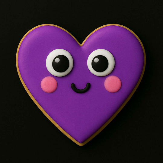 Heart-shaped cookie with a smiley face on a black background