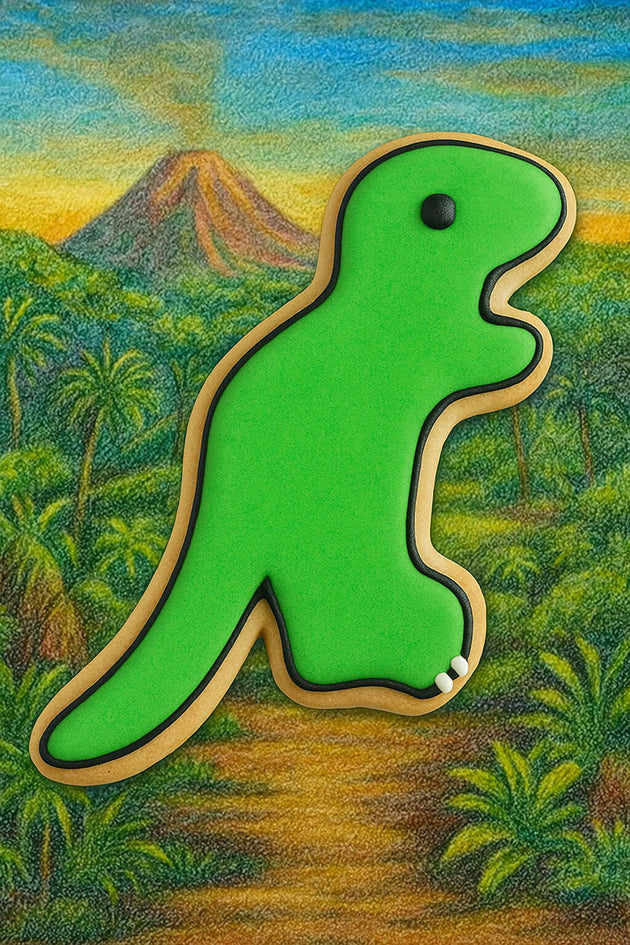 Green dinosaur-shaped object with a mountain and jungle background from a 5.5 inch Tyrannosaurus Rex Metal Cookie Cutter
