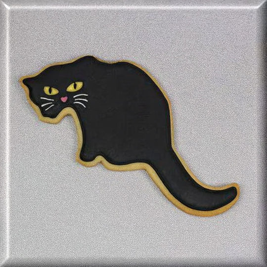 Black cat-shaped cookie on a silver background from a 5.5 inch Cat Metal Cookie Cutter