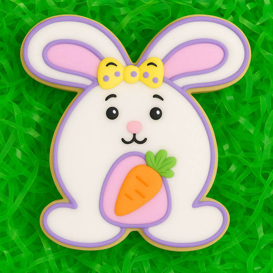 4 inch Easter Bunny Rabbit Metal Cookie Cutter shaped cookie decorated with a carrot, perfect for springtime baking.