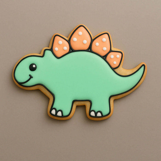 Stegosaurus-shaped cookie with green body, orange spikes, and brown outline on a beige background from a 4 inch Stegosaurus Metal Cookie Cutter