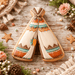 Decorative cookies shaped like teepees on a rustic wooden surface with flowers and pine cones from  4 inch Teepee Metal Cookie Cutter