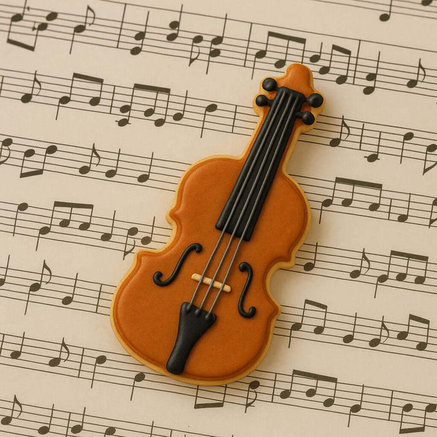 Cookie shaped like a violin on sheet music from a 4 inch Violin Metal Cookie Cutter