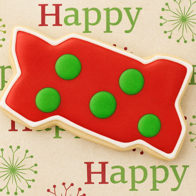 Red and green polka dot cookie with 'Happy' text on a decorative background from a 5.5 inch Zig-Zag Interlocking Brick Metal Cookie Cutter