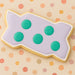 Cookie  with purple icing and green dots on a polka dot background 4 inch Zig-Zag Interlocking Brick Metal Cookie Cutter